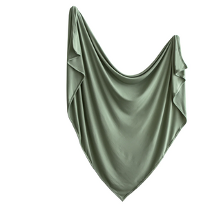 Mushie Stretchy Swaddle in dried thyme and natural