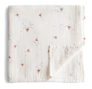 Mushie Organic Cotton Muslin Swaddle Blanket in assorted patterns
