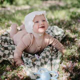 Mushie Organic Cotton Muslin Swaddle Blanket in assorted patterns
