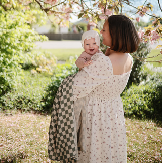 Mushie Organic Cotton Muslin Swaddle Blanket in assorted patterns