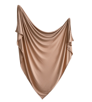 Mushie Stretchy Swaddle in dried thyme and natural