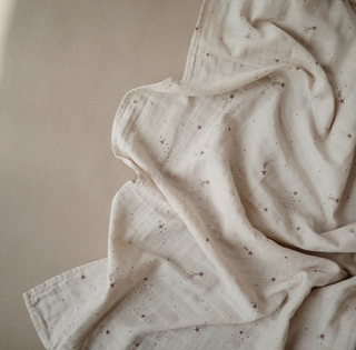 Mushie Organic Cotton Muslin Swaddle Blanket in assorted patterns