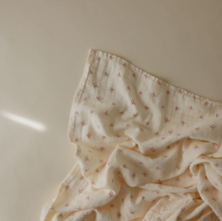 Mushie Organic Cotton Muslin Swaddle Blanket in assorted patterns