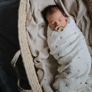 Mushie Organic Cotton Muslin Swaddle Blanket in assorted patterns